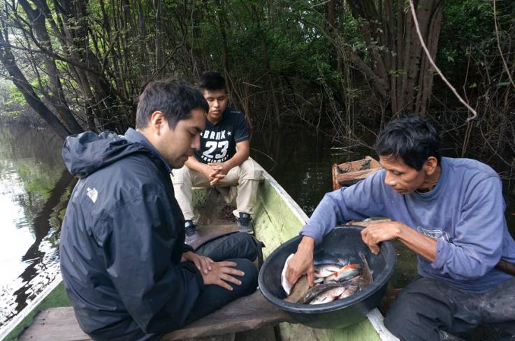 Jorge "Coco" Alarcon interviews a fisherman in Peru