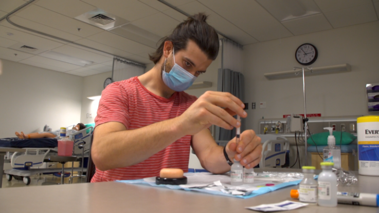 In a bootcamp that launched in January, University of Washington School of Nursing students train other UW students and faculty who hope to help in COVID-19 vaccinations. (Kiyomi Taguchi / University of Washington Photo)