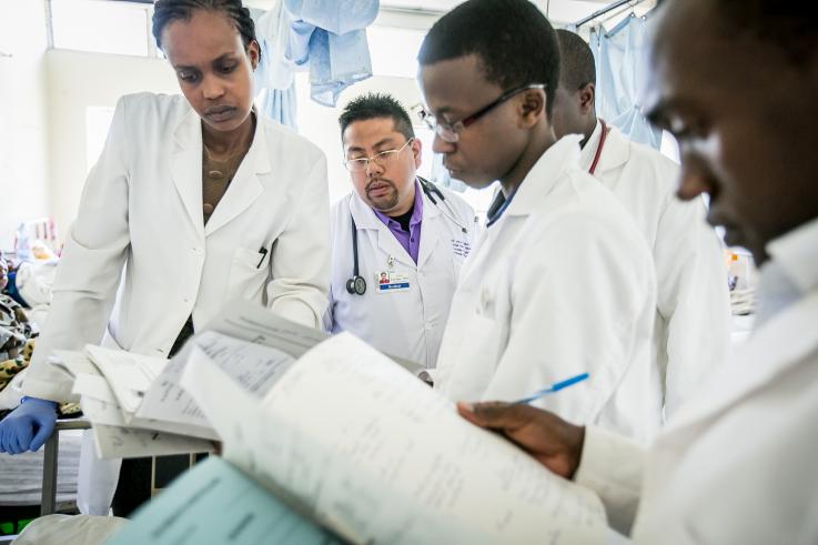 Photo of UW residents working with Kenyan medical students in Naivasha District Hospital