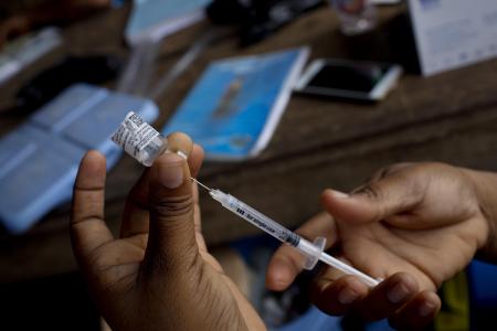 Photo of a nurse preparing a vaccination at a clinic in Accra, Ghana
