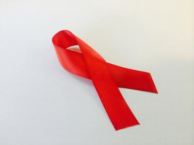 Image of a red ribbon, the universal symbol of awareness and support for people living with HIV