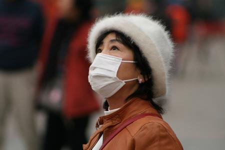 Woman wears a mask in China