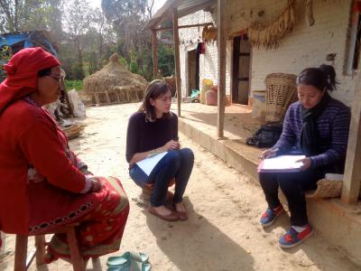 Photo of a student conducting verbal autopsy interviews in Nepal