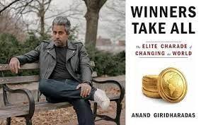 Photo of author Anand Giridharadas next to his book 'Winners Take All'