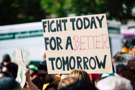 CHanGE Web Image Depicting a Sign Reading "Fight Today for a Better Tomorrow"