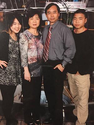 Photo of Xiao-Hua Zhou with his family