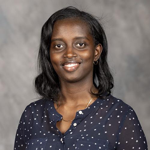 Headshot of Christelle Urujeni wearing professional attire.