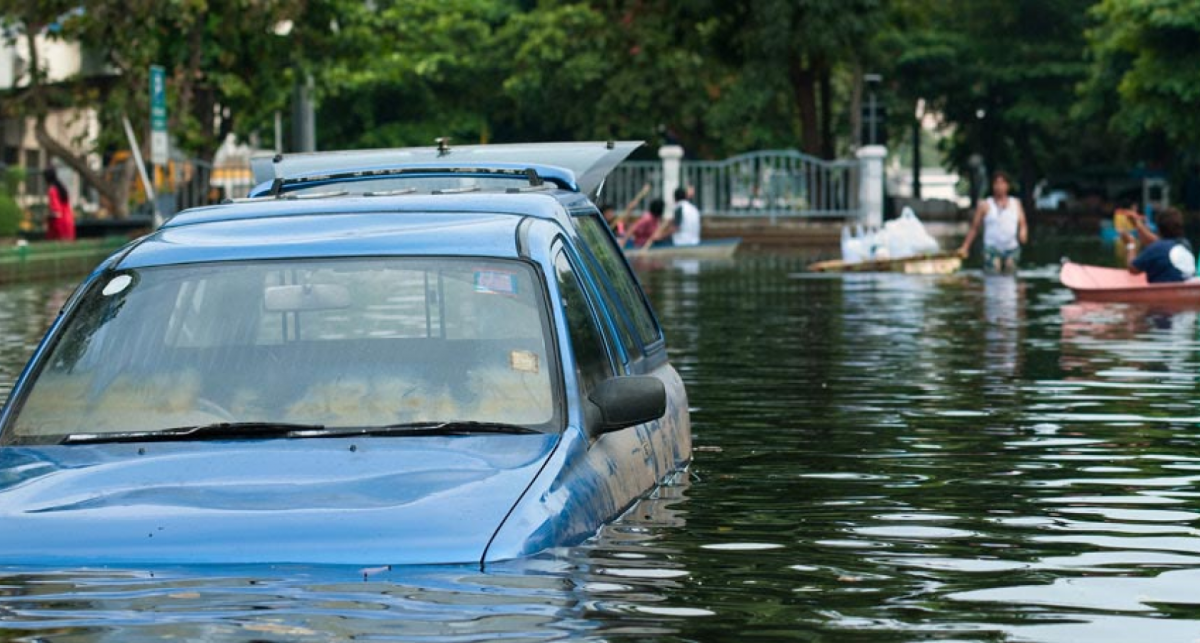 Blue Car Caught in Flood