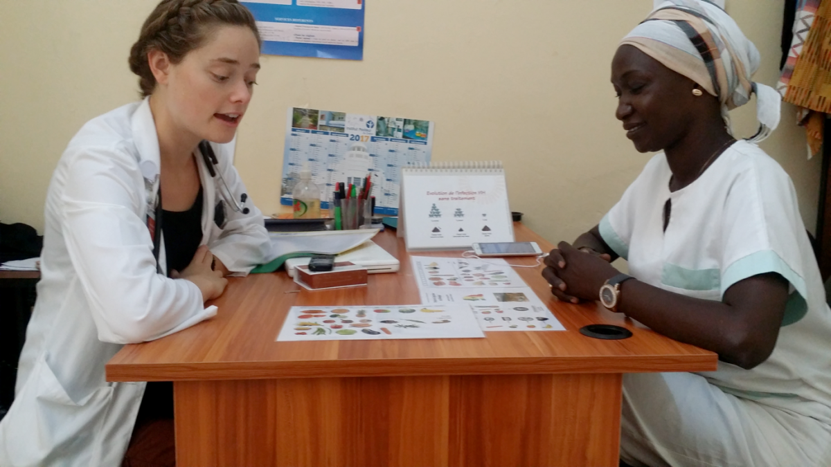 Photo of Sylvia counseling a social worker in Senegal