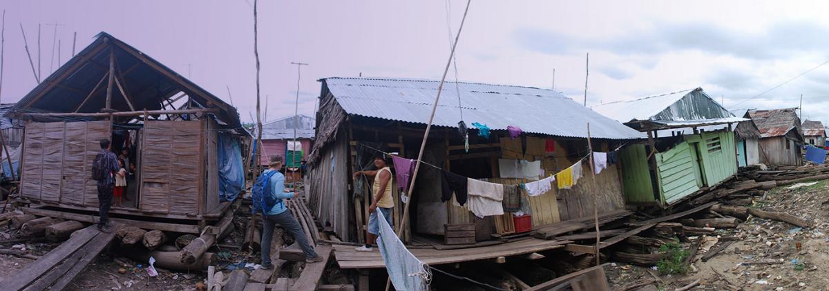The research team doing an housing evaluation in a floating slum in Peru.
