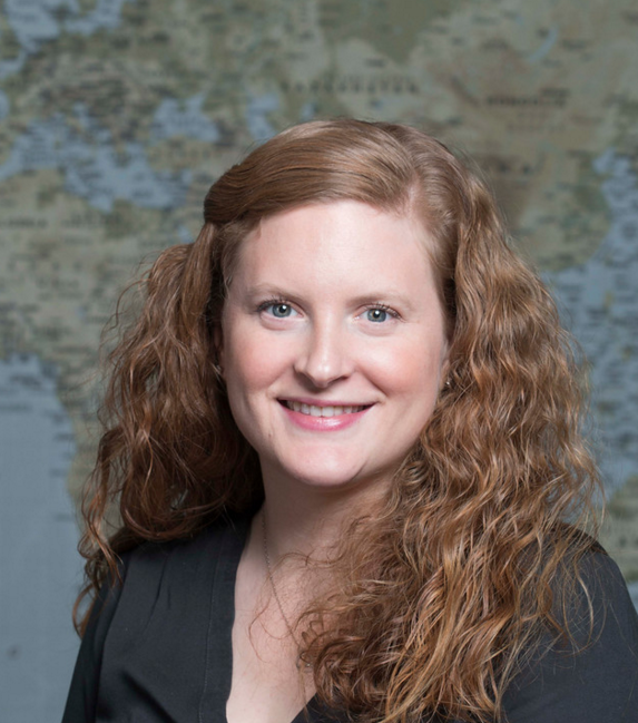 Profile photo of Mallory Erickson in front of world map