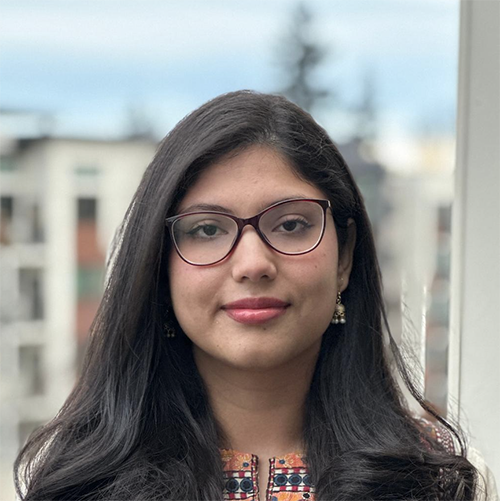 Headshot of Mariyam Sibghatullah smiling in professional attire.