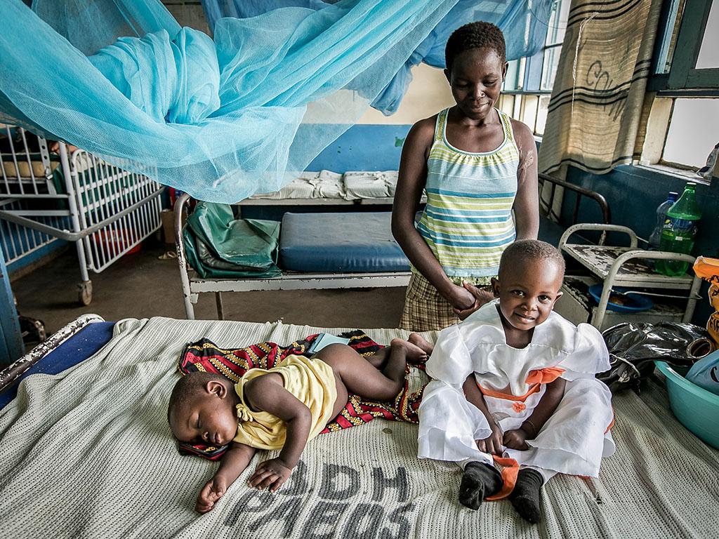 A mother with her two young children at a Global WACh research site in Bondo, Kenya