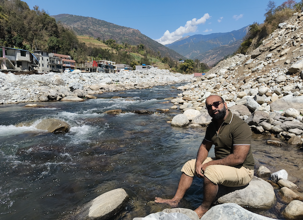 Novil sitting in a stream.