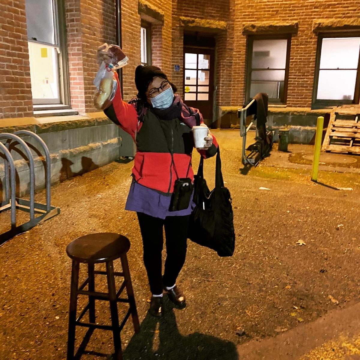 Evalynn Romano posing outside a custodial building