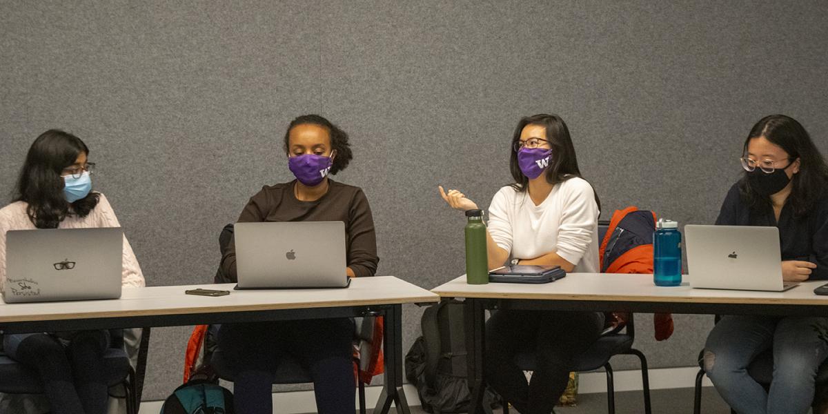 students speaking in class