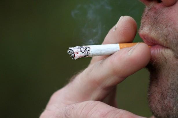 A man smoking a cigarette
