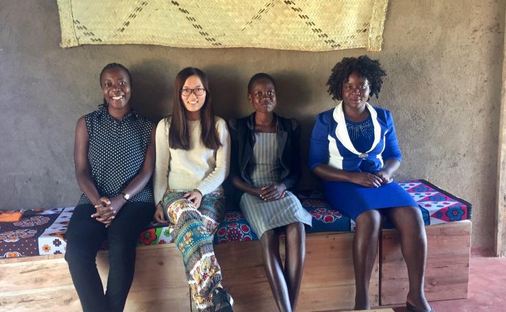 Photo of Yilin with health volunteers and community women in Kenya
