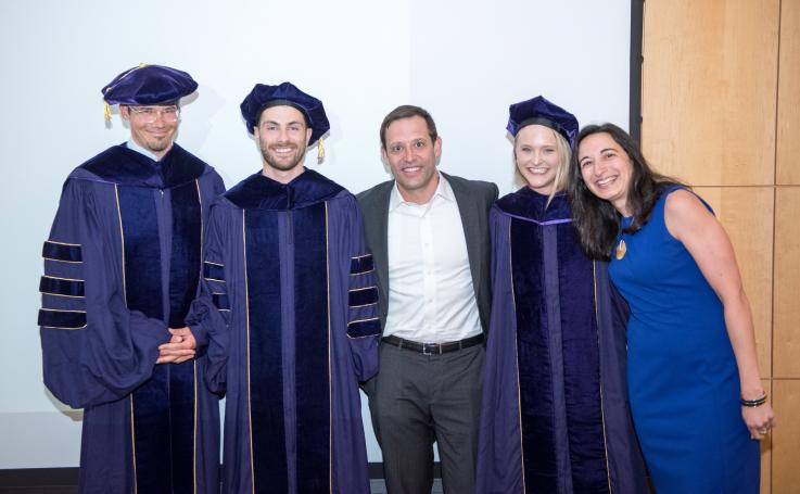 Photo of PhD faculty and graduates